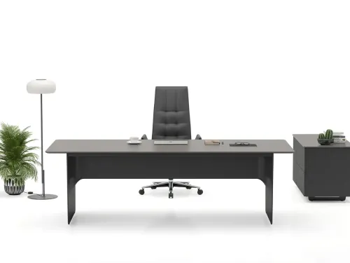 LEAD antrasit yönetici masası, etajer bağlantısı ve akışkan ön paneliyle modern liderlik için yalın, güçlü ve dengeli bir çalışma zemini sunar.