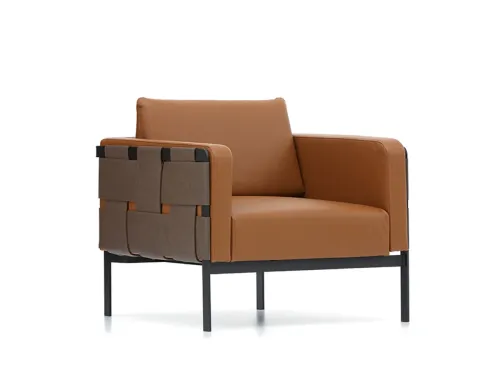 Taba tonundaki Piet koltuk; yumuşak hacmi, örgü yan panel etkisi ve modern ayak yapısıyla resepsiyon ve bekleme alanlarında güçlü bir karakter sunar.
