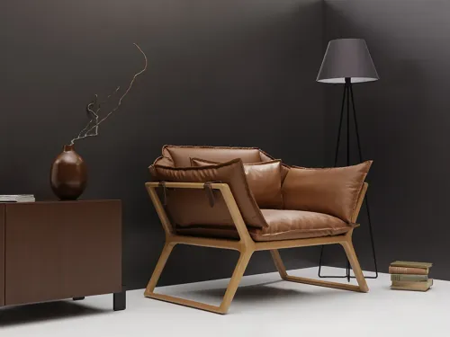 STAY tekli koltuk kahverengi deri, deri kayışlı koltuk detayı ve masif ahşap iskeletiyle ofis bekleme koltuğu ve modern lounge koltuk arayan projelere akılda kalan bir duruş kazandırır.